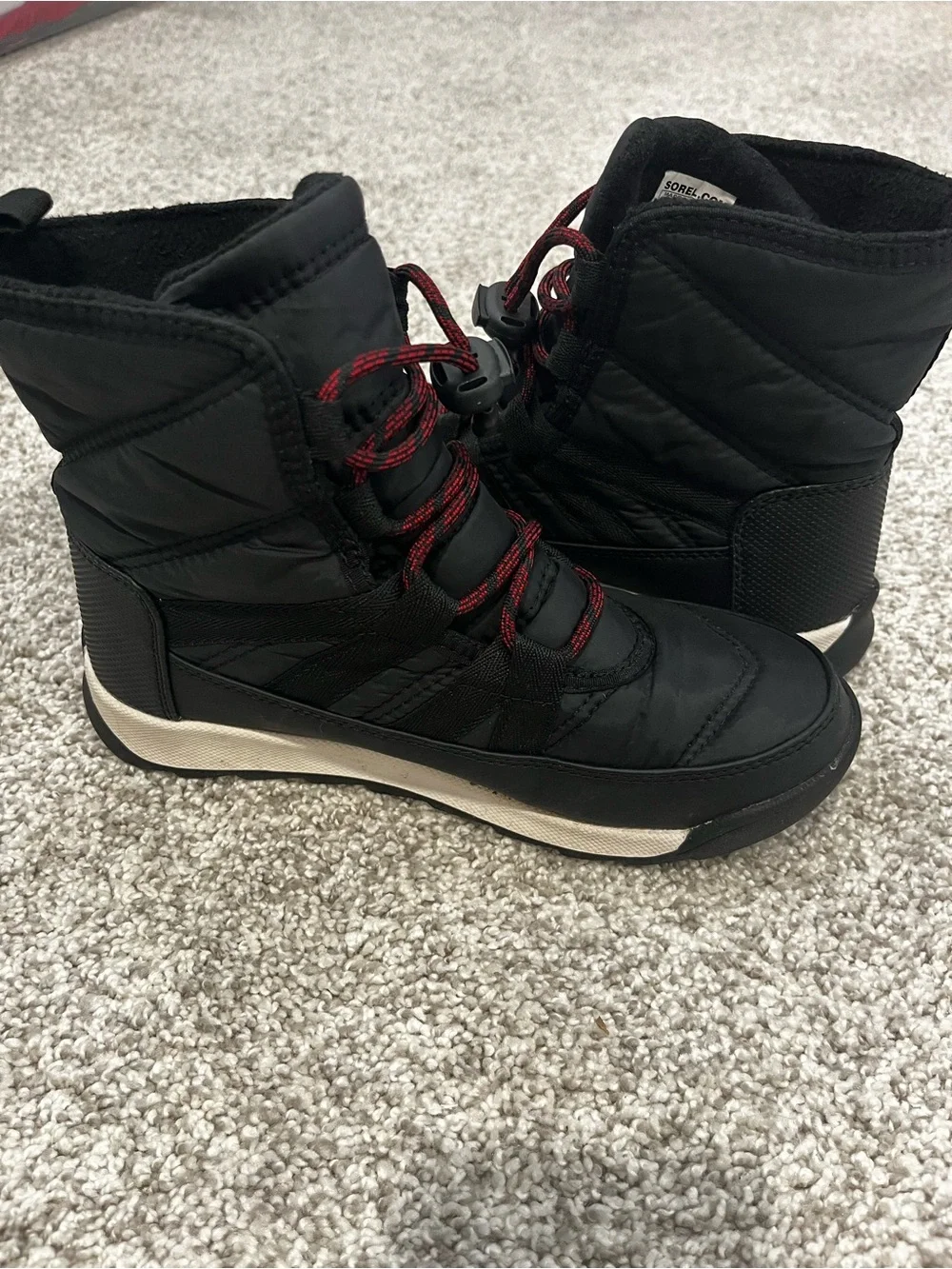 Sorel Kids Black Snow Boots with Red Lace Accents